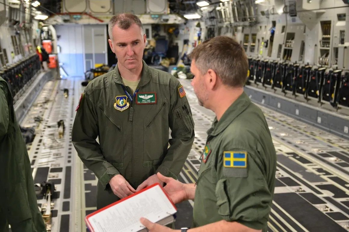 Greg Ford aboard a C-17 with a NATO partner